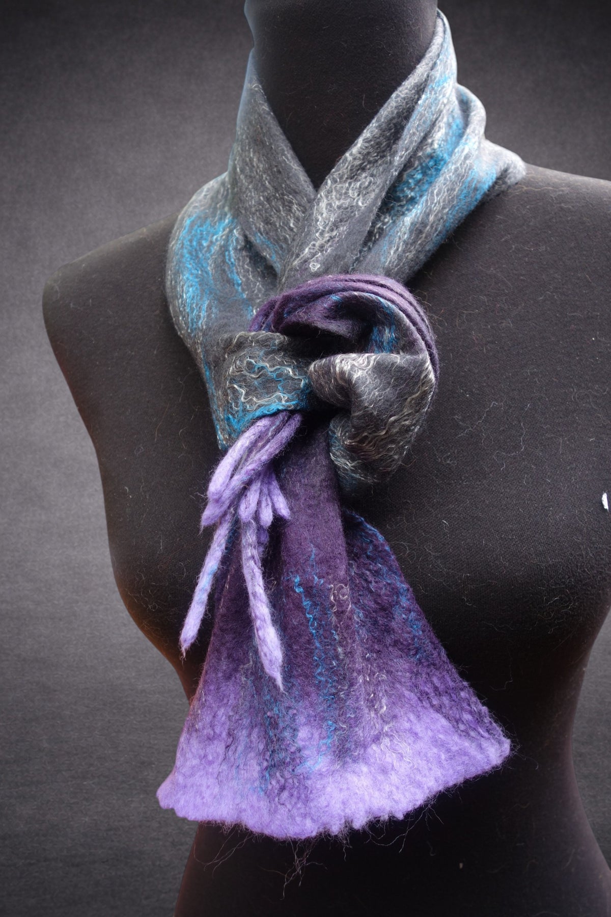 Sculptural hand-felted scarf detail on mannequin