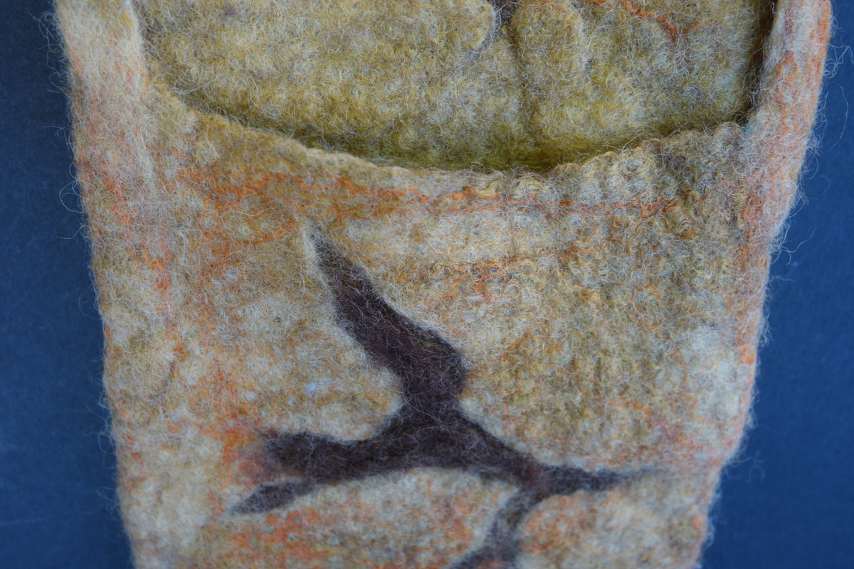Close-up of back phone pocket on Cracked hand-felted bag
