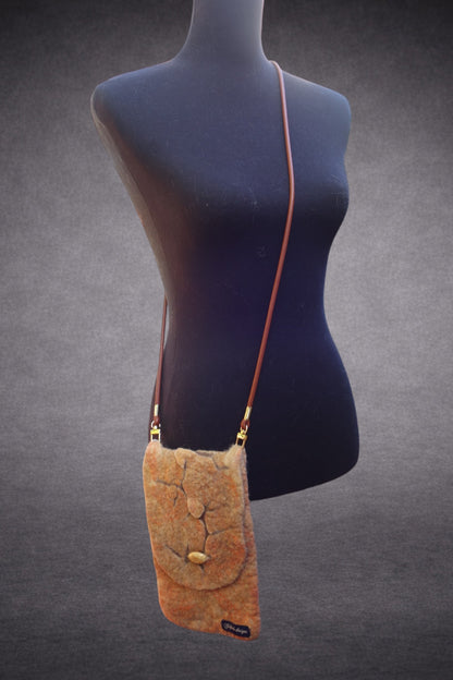 Cracked hand-felted crossbody bag shown on mannequin
