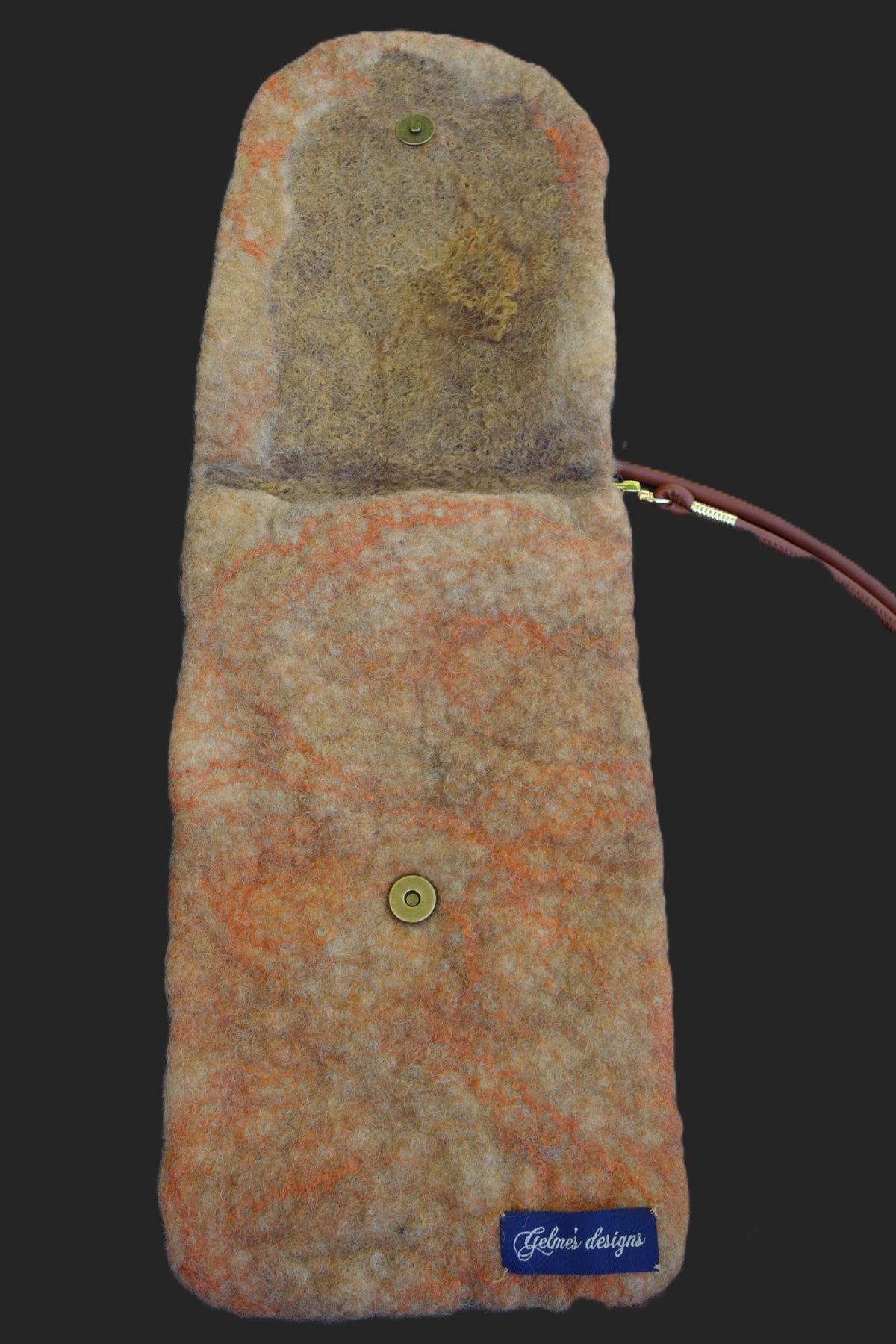Cracked crossbody bag, open view showing magnetic closure