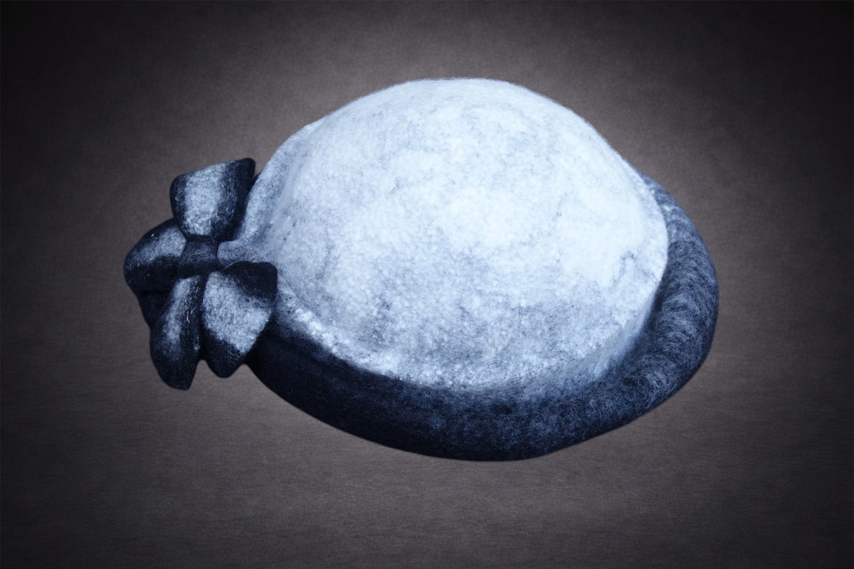 Black and ivory asymmetric hand-felted hat, product view