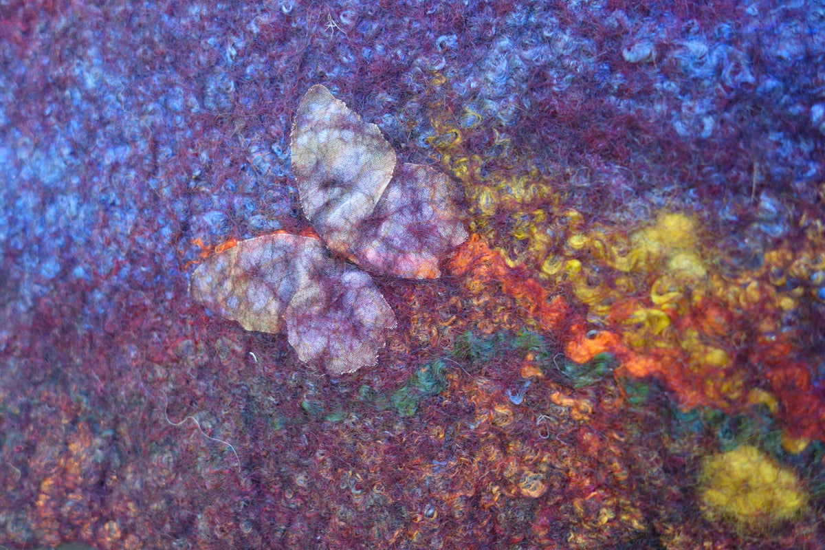 Close-up of butterfly and warm fiber details on Butterfly Fire bag