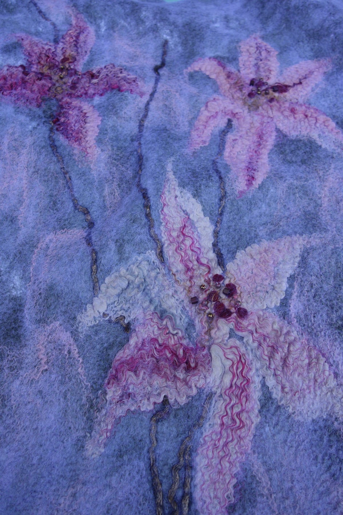 Close-up of felted lilies on Lilies in the Morning Fog poncho