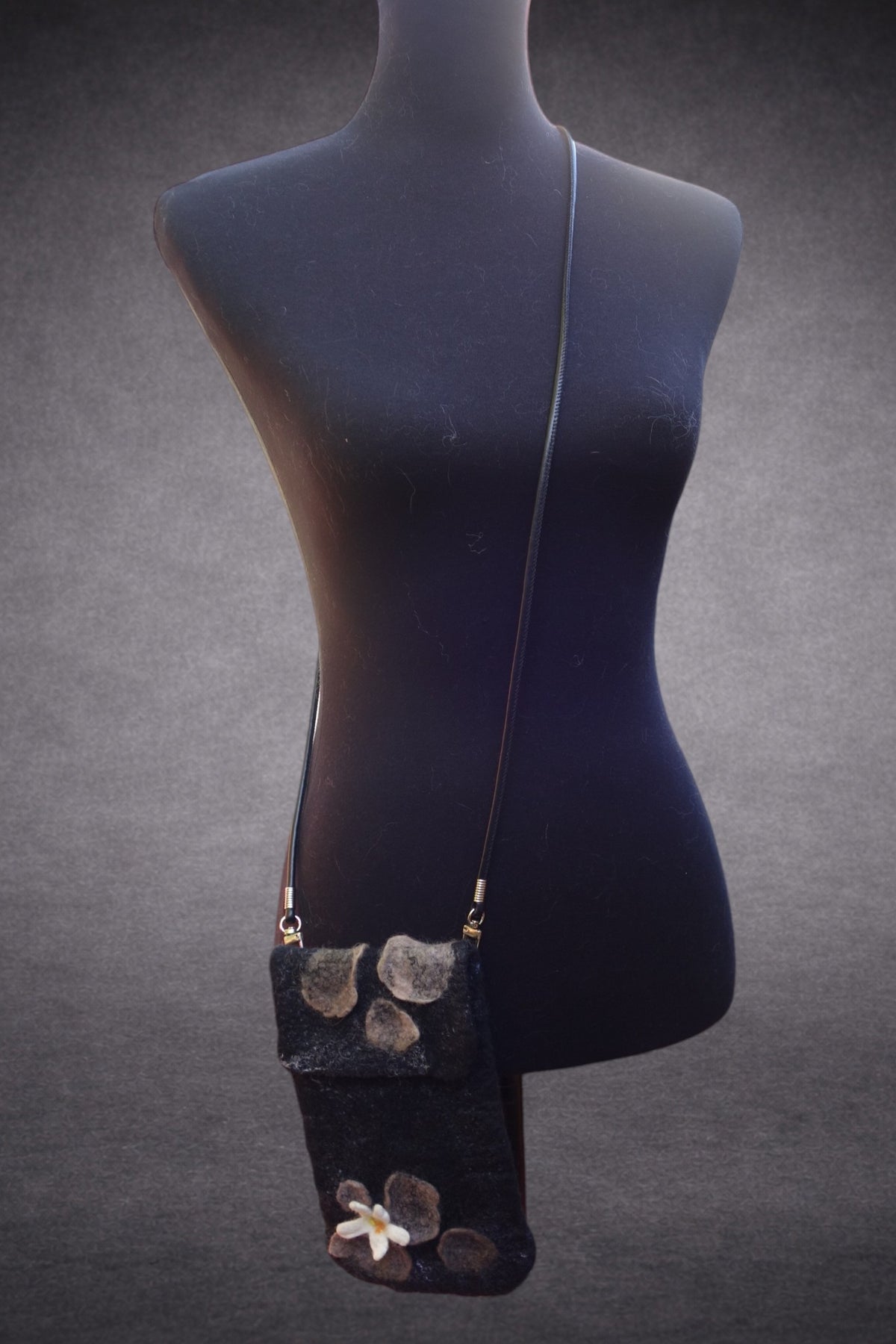 Beauty Through the Cracks in the Stone crossbody bag shown on mannequin