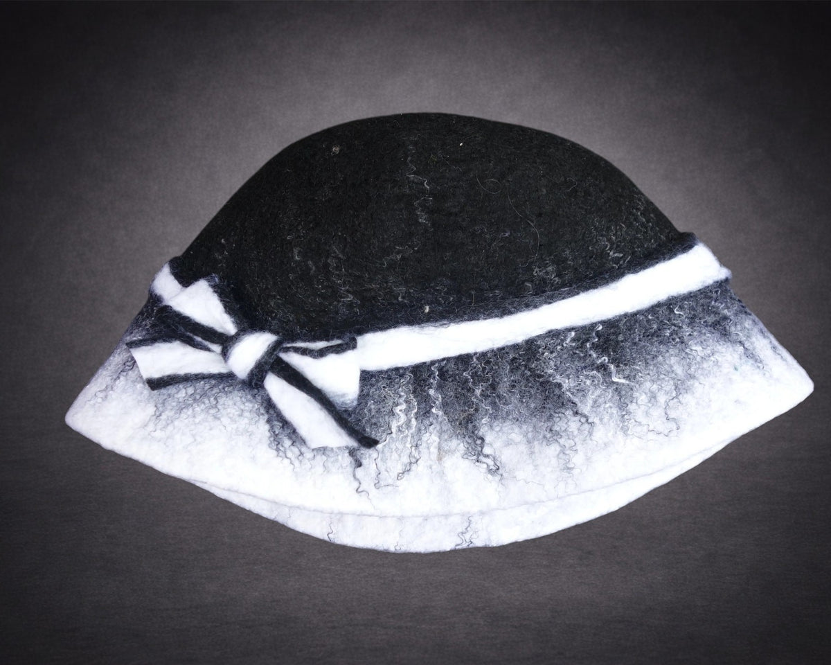 Black and white soft hand-felted bucket hat angled view