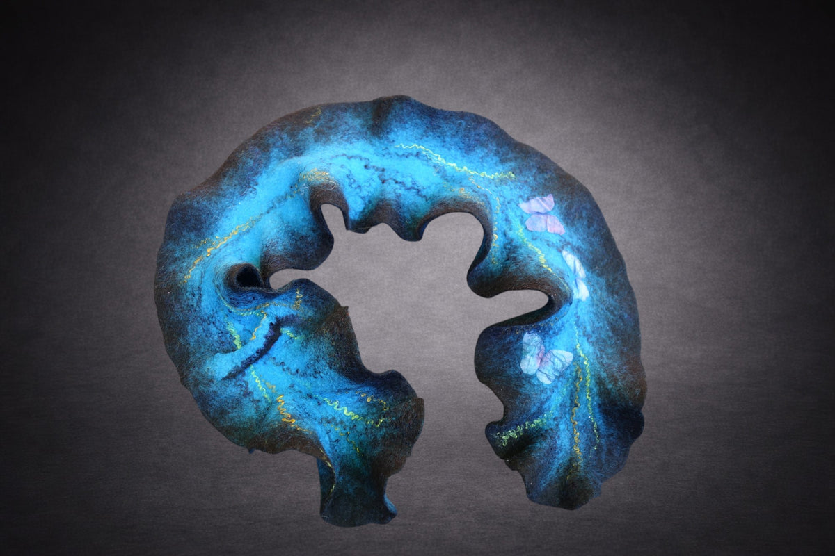 Blue sculptural ruffled scarf detail