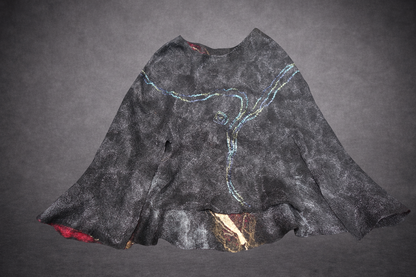Fire in the Night poncho reverse side laid flat, alternate blue green view
