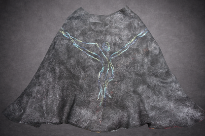 Fire in the Night poncho laid flat, reverse side in black grey blue and green