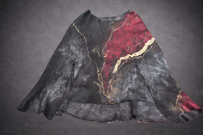 Fire in the Night poncho laid flat, alternate view of burgundy red and gold side