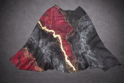 Fire in the Night poncho laid flat, black burgundy red and gold side