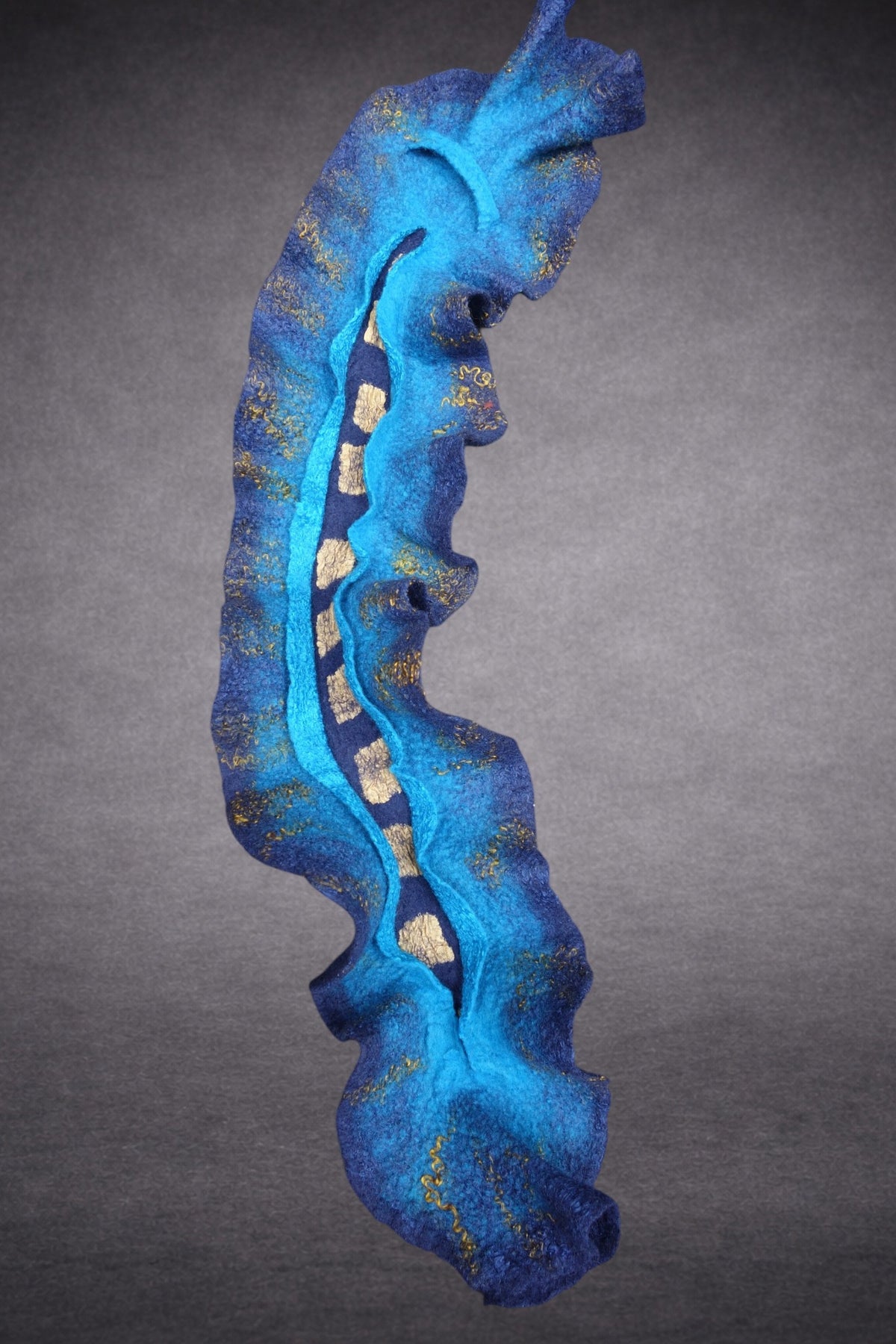 Blue and turquoise sculptural scarf detail