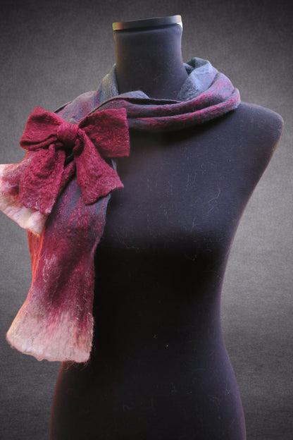 Side view of hand-felted grey-blue and burgundy scarf with bow