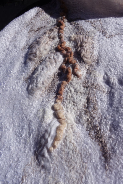 Close-up of nuno-felted silk and organza texture on Ivory Sands poncho