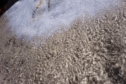 Close-up of sand-toned textured fibers on Ivory Sands poncho