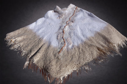 Ivory Sands poncho laid flat, warmer sand-toned side