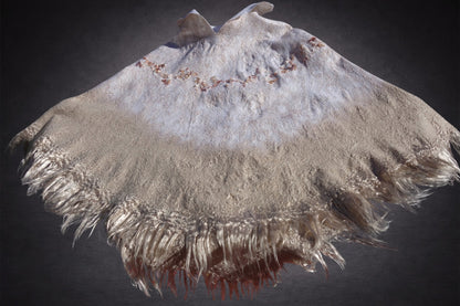 Ivory Sands poncho laid flat, lighter white side