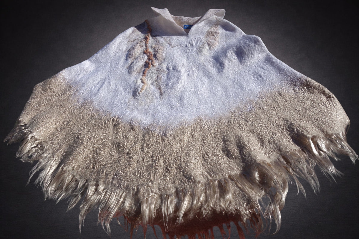 Ivory Sands reversible nuno-felted poncho on mannequin, front view