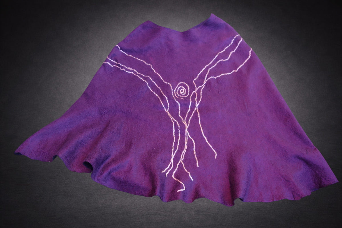 Northern Lights reversible poncho laid flat, alternate side