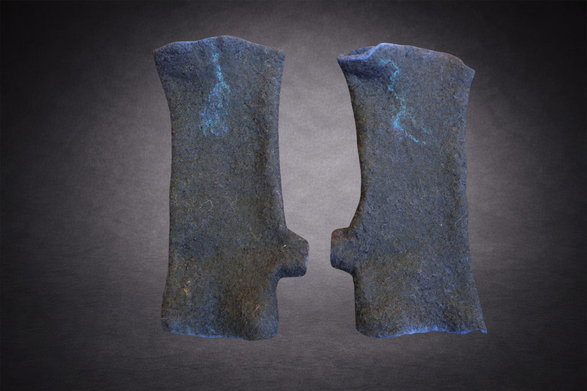 Deep blue hand-felted fingerless gloves shown from the plain side