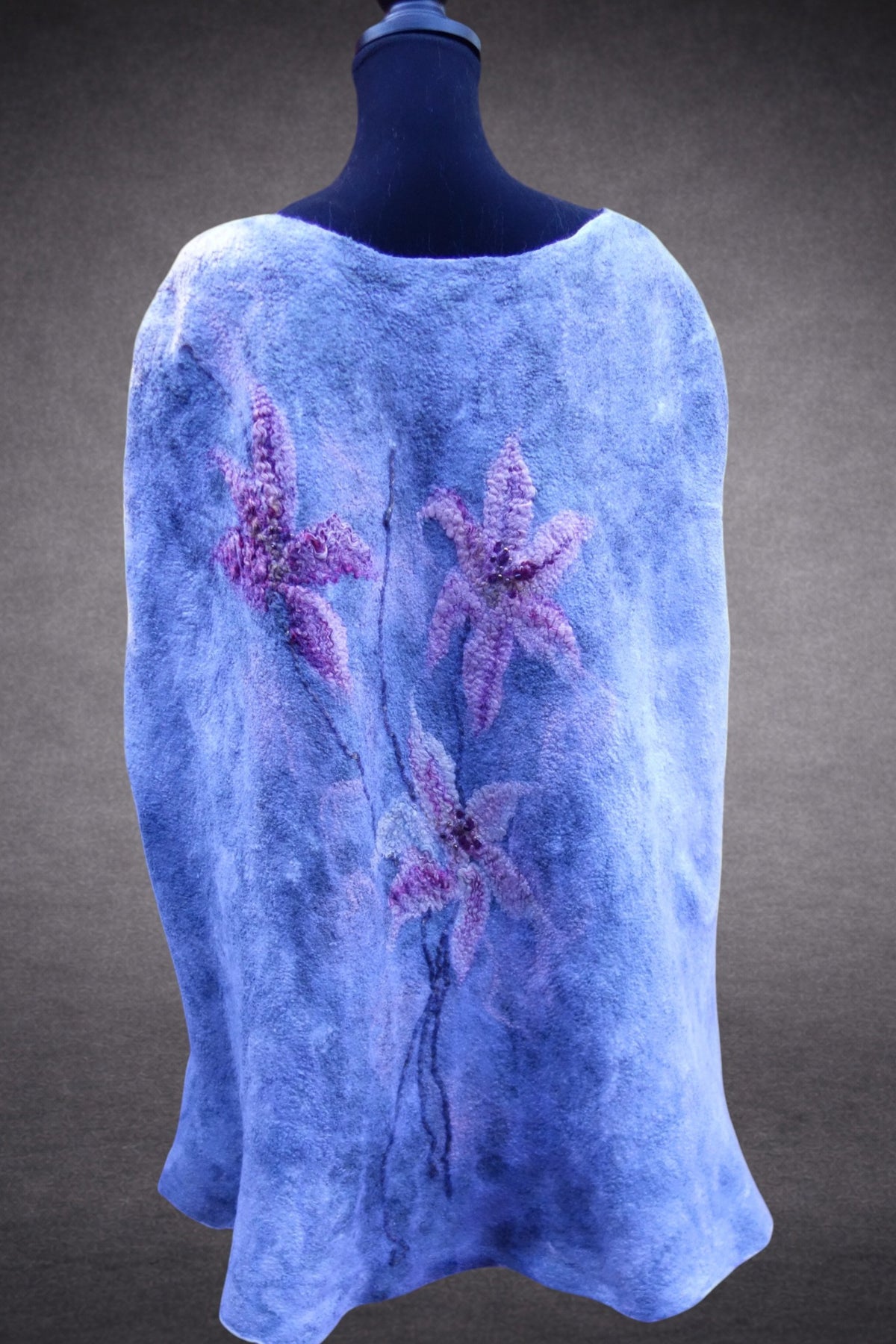 Lilies in the Morning Fog poncho cape back view on mannequin
