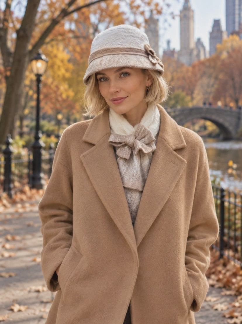 Ivory and beige hand-felted bucket hat shown in motion