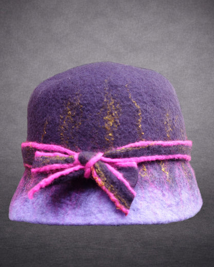 Hand-felted purple bucket hat with fuchsia edged bow and gold fiber accents