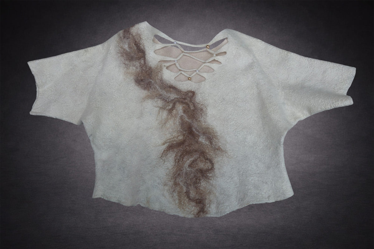 Handmade felted wool top laid flat showing sculptural openwork back neckline