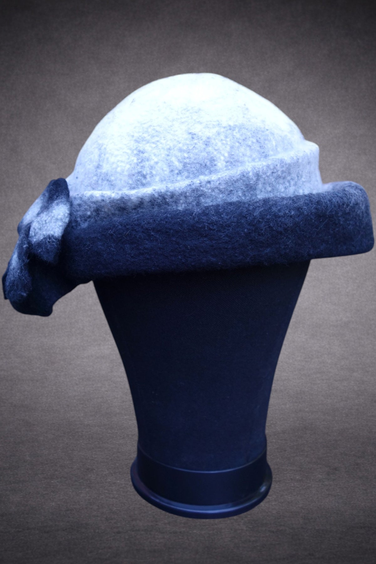 Black and ivory asymmetric felted hat, side and back mannequin view